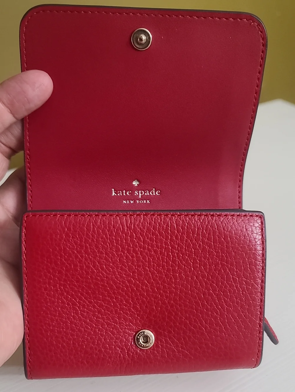 kate spade red pebbled leather trifold wallet with gold spade logo
